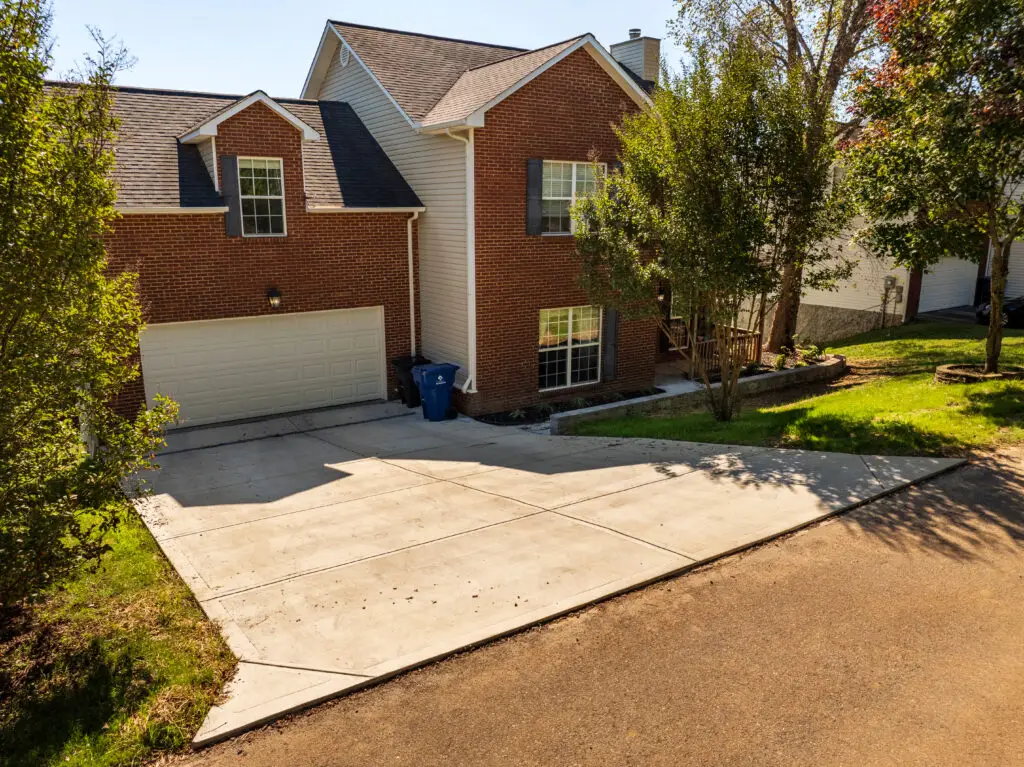 Anchored Construction concrete driveway and retaining wall