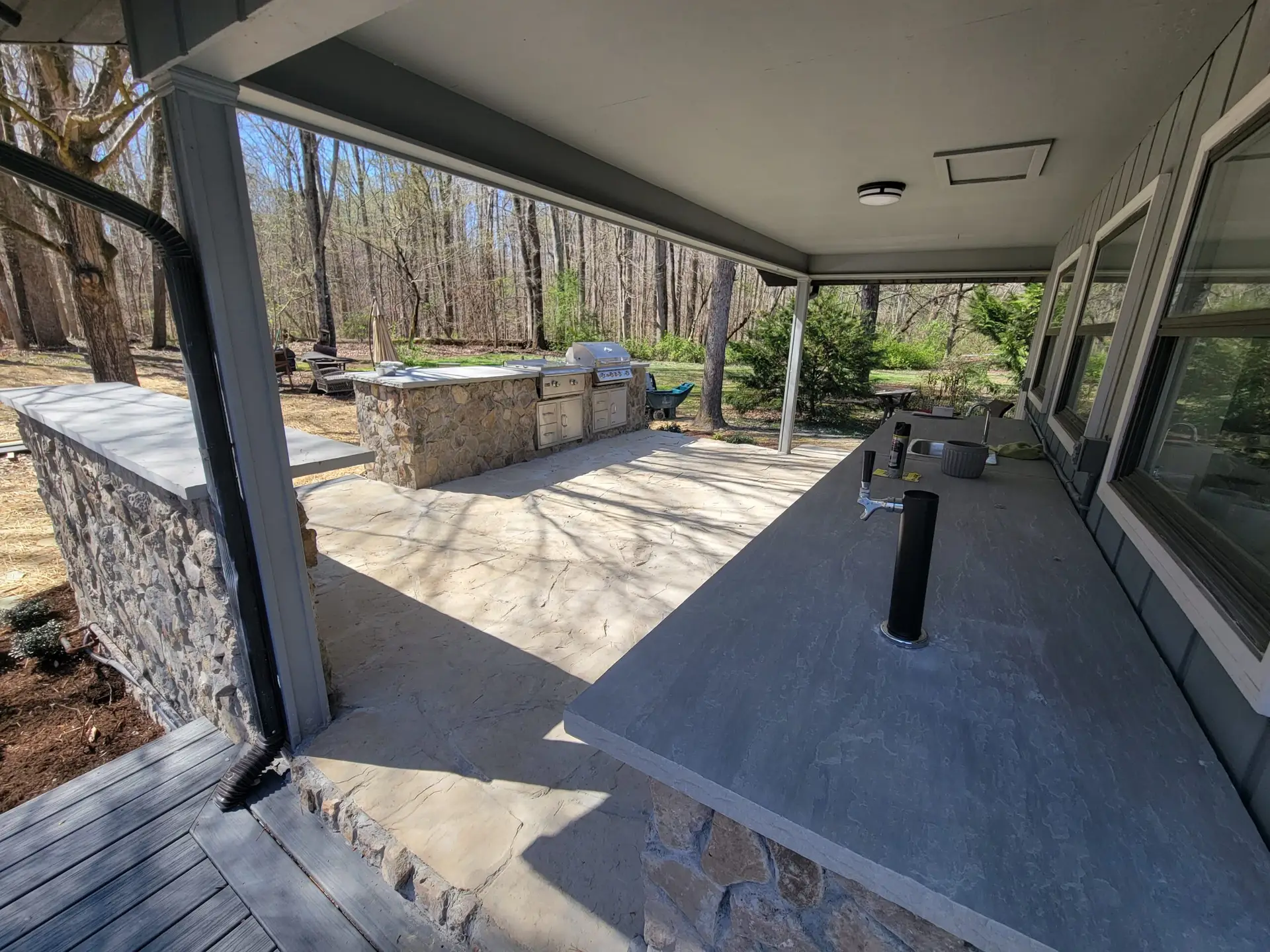 Outdoor kitchen with grill and kegerator